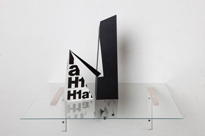 Untitled Spatial configuration, cardboard folded abstract constructions and page from Letraset book with Helvetica font, 2009 
